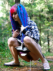 Young cutie empties her bladder in the forest
