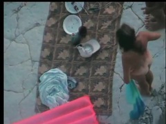 Lingerie Mania presents: Naked couple stretches slowly on the beach